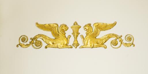 Embossed gold griffons in the French Room.