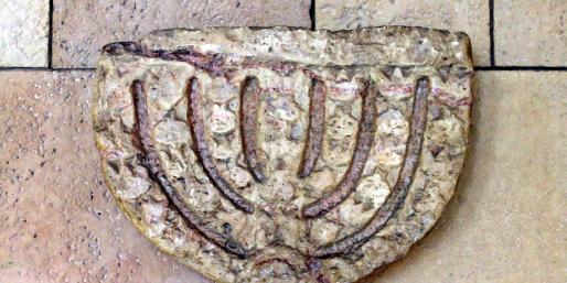 Carved menorah on the wall
