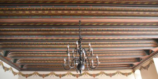 Decorative celing with chandelier in the Polish Room.